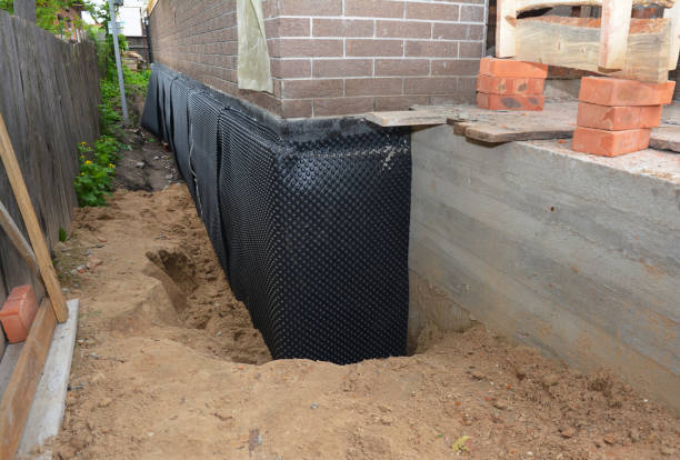 Happy homeowners after waterproofing job in Morganville